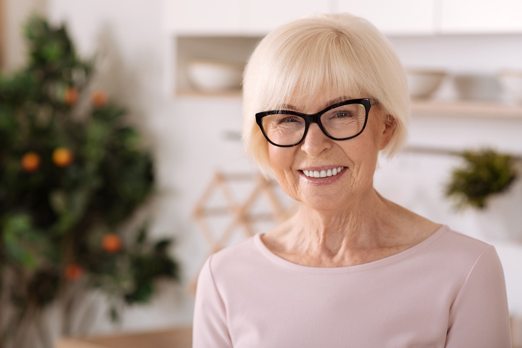 Woman smiling after getting dentures in Dawsonville, GA